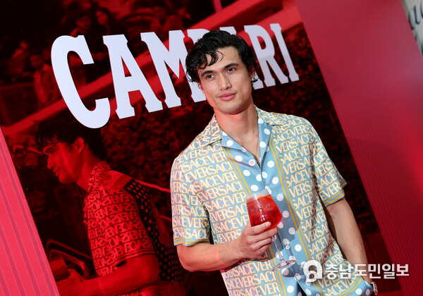 Actor Charles Melton enjoys a Campari aperitif at Campari: Discover Red event experience ahead of his premiere for May December at the 76th Annual Festival de Cannes. Actor Charles Melton enjoys a Campari aperitif at Campari: Discover Red event experience ahead of his premiere for May December at the 76th Annual Festival de Cannes.