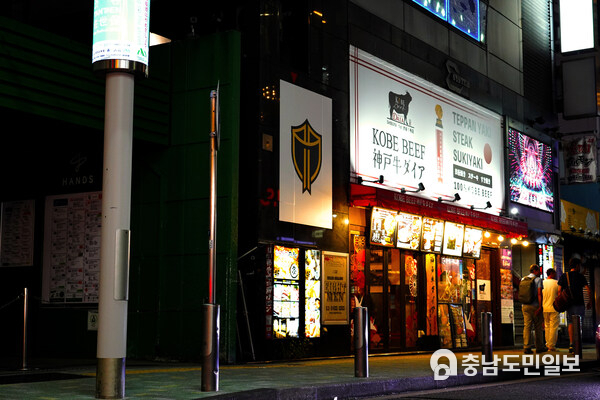 Residents and visitors in Tokyo's bustling Shibuya district were met with posters appearing featuring the International Shield emblem Residents and visitors in Tokyo's bustling Shibuya district were met with posters appearing featuring the International Shield emblem
