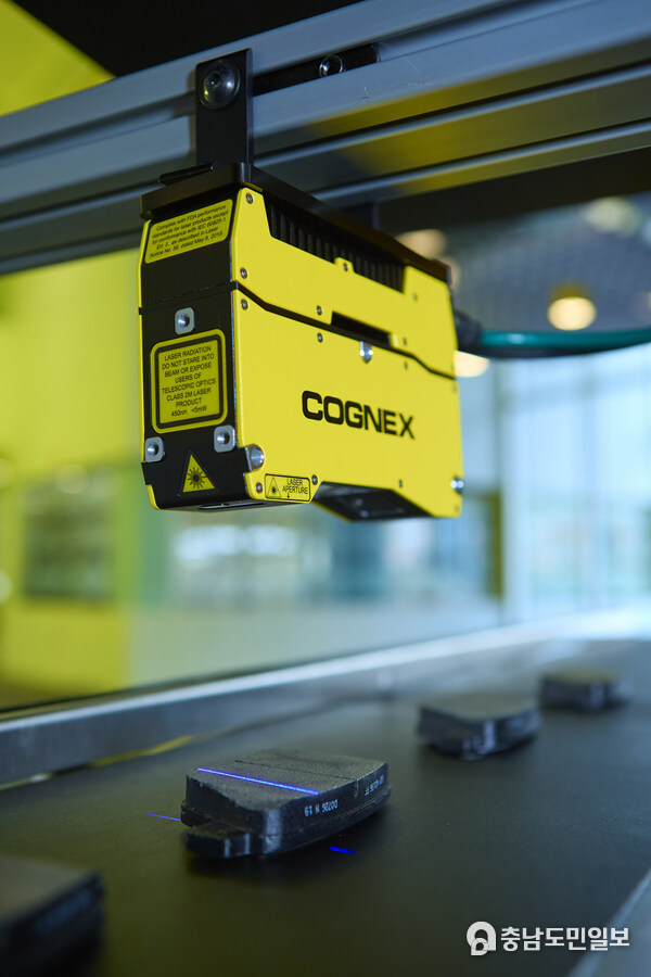 The Cognex In-Sight L38 mounted over an assembly line, inspecting products in 3D.