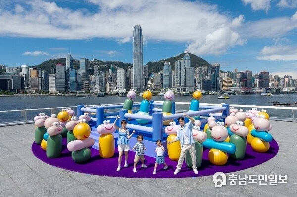 Happy Flipping Boxing Ring with more than 30 inflatables tumblers is set against the stunning backdrop of Victoria Harbour