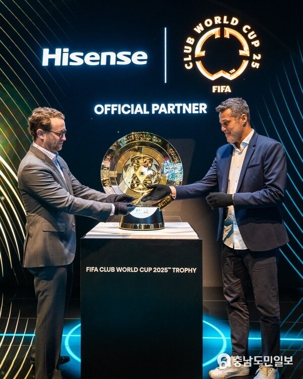 David Gold, Vice President of Hisense International and President of Hisense Americas and Aldo Kafie, Head of FIFA Partnership Management, unveil the FIFA Club World Cup 2025™ Trophy at CES