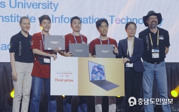 The Tokyo trio celebrating victory in the ICPC Challenge